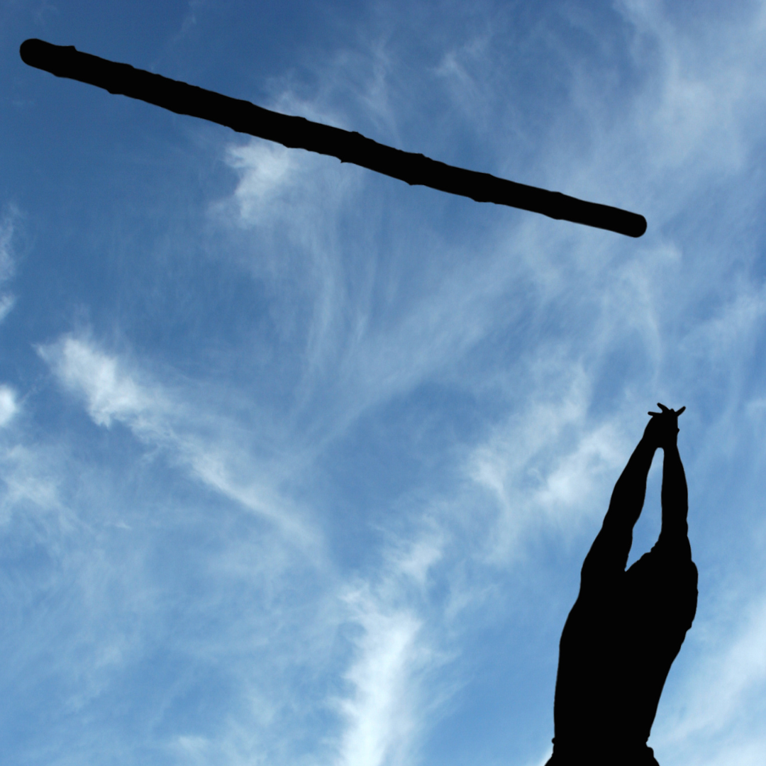 Image of someone throwing a caber into the air