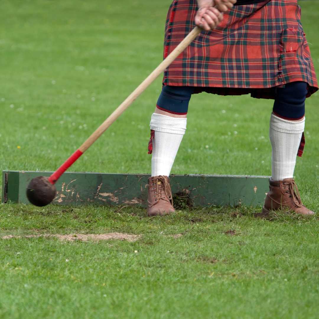 A person in a kilt preparing to throw the hammer