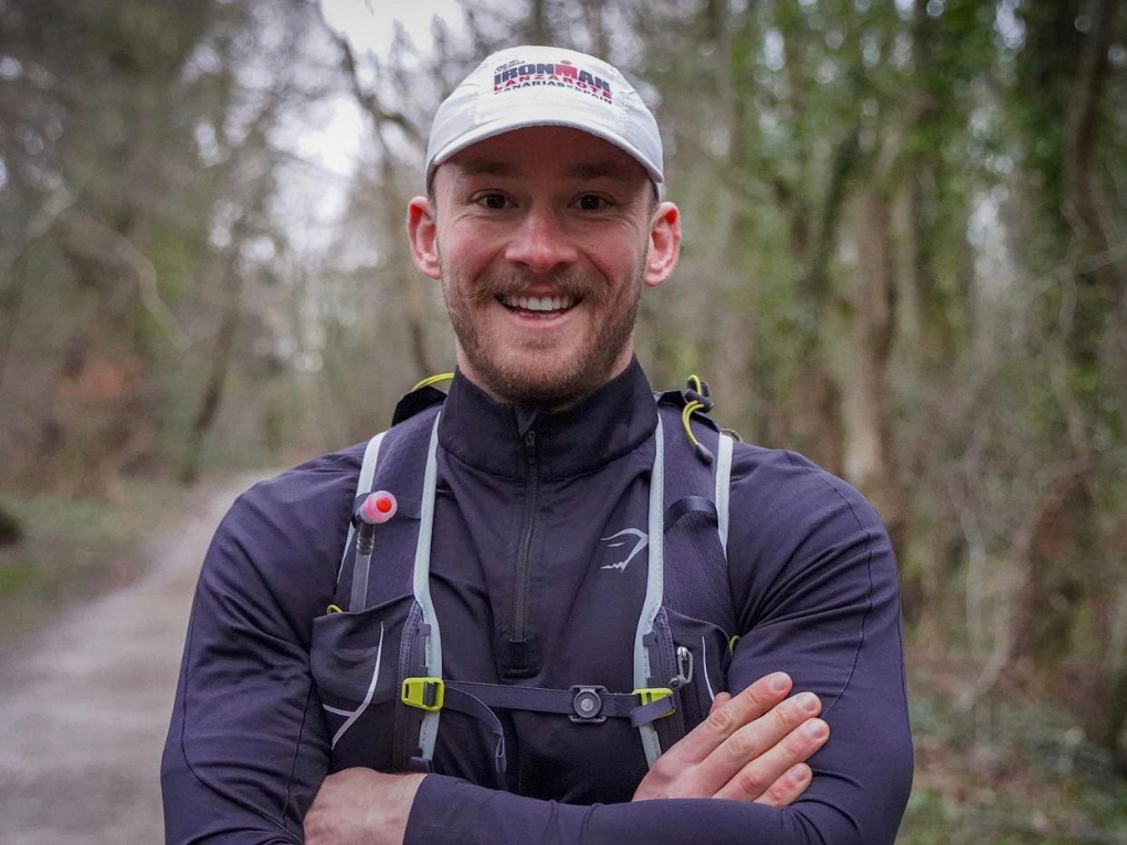 Fergus Crawley smiling in the woods