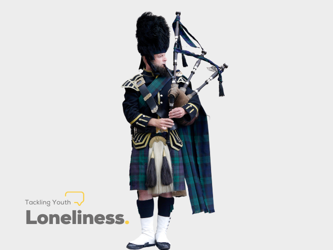 Man in kilt playing bagpipes
