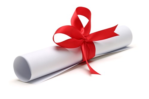 White scroll tied up by a red ribbon