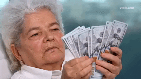 Elderly lady counting cash