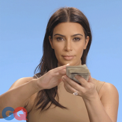 Kim Kardashian with a wad of cash